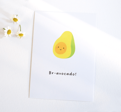 Avocado postcard A6 size green watercolour cute avocado with smiley face on white background and small white flowers