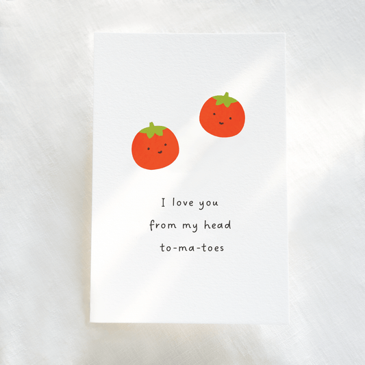 Card with two cartoon tomatoes and text 'I love you from my head to-ma-toes' on a white 310gsm paper background 