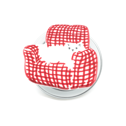 Red checkered cat on couch magsafe popgrip phone holder on a white background